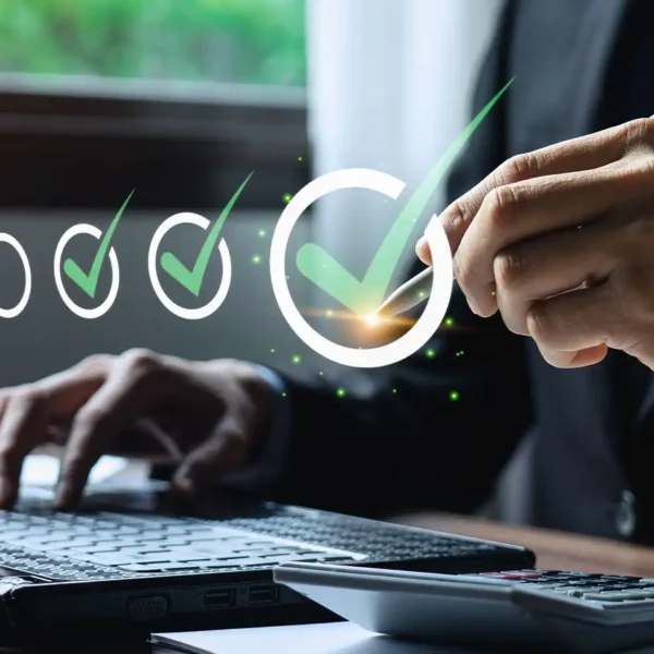 Business professional conducting audit and assurance services on laptop computer