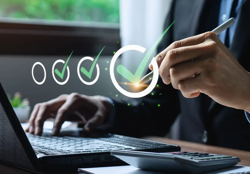 Business professional conducting audit and assurance services on laptop computer