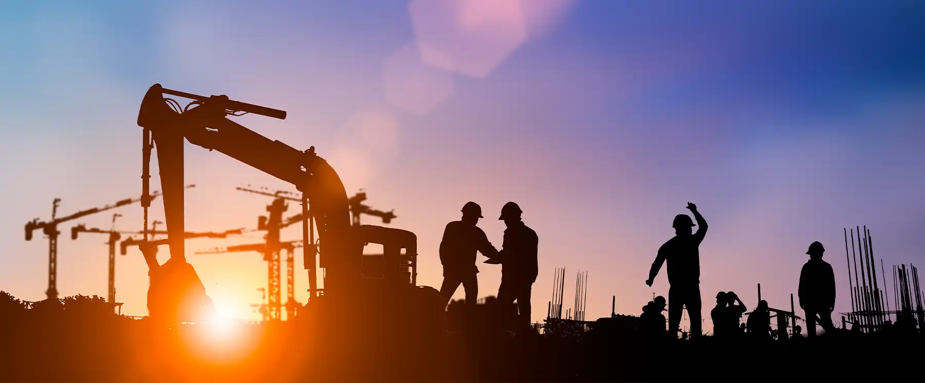 Construction workers and equipment at building site representing construction industry operations